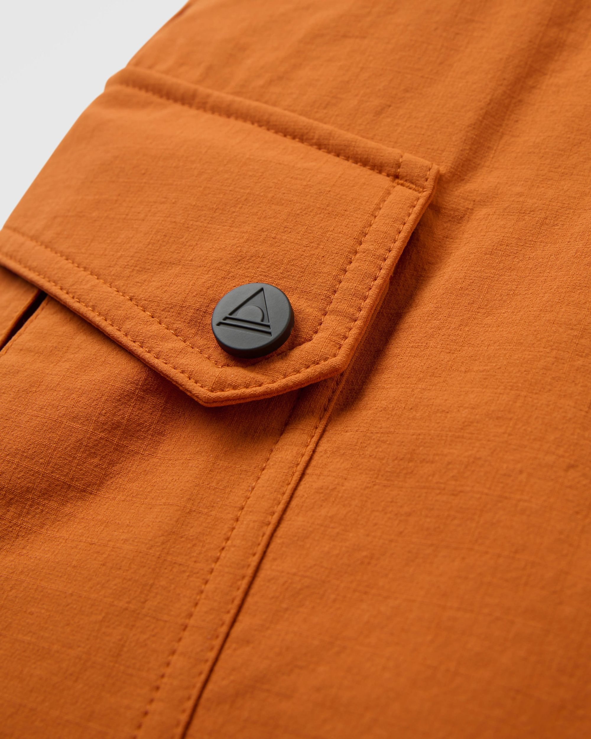 Sandstone Recycled Active Trail Short - Sunset Orange - Flatlay