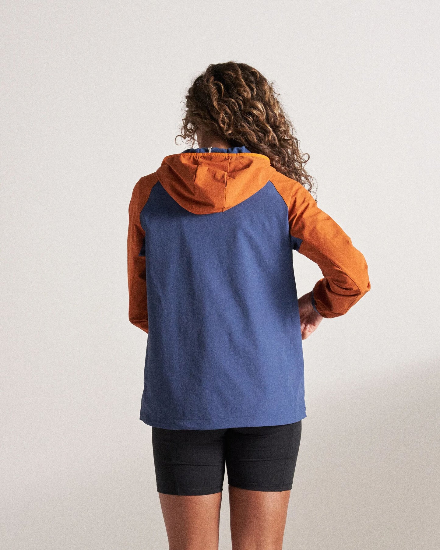 Ocean Light Recycled Softshell Jacket - Dark Denim/Sunset Orange - Studio Model