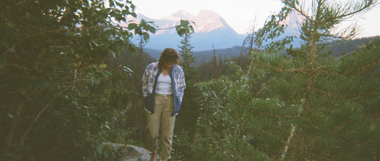 Elyssa stands on a rock in the Canadian wilderness